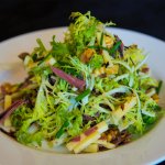 Salad with mixed greens, nuts and pastrami